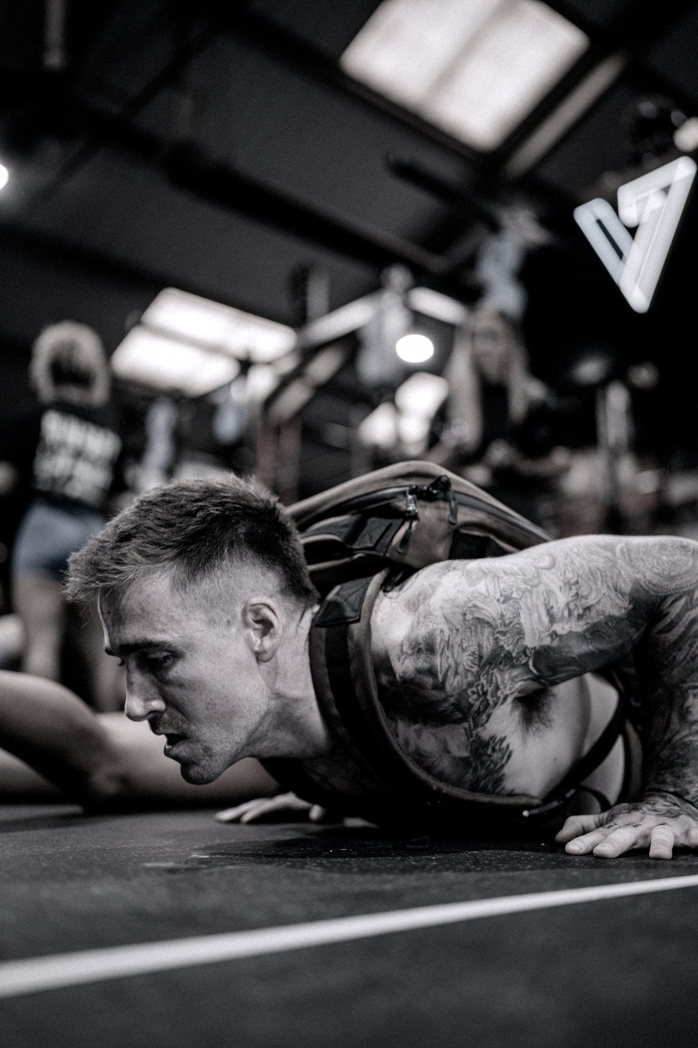 Athlete mid press-up wearing a loaded vest
